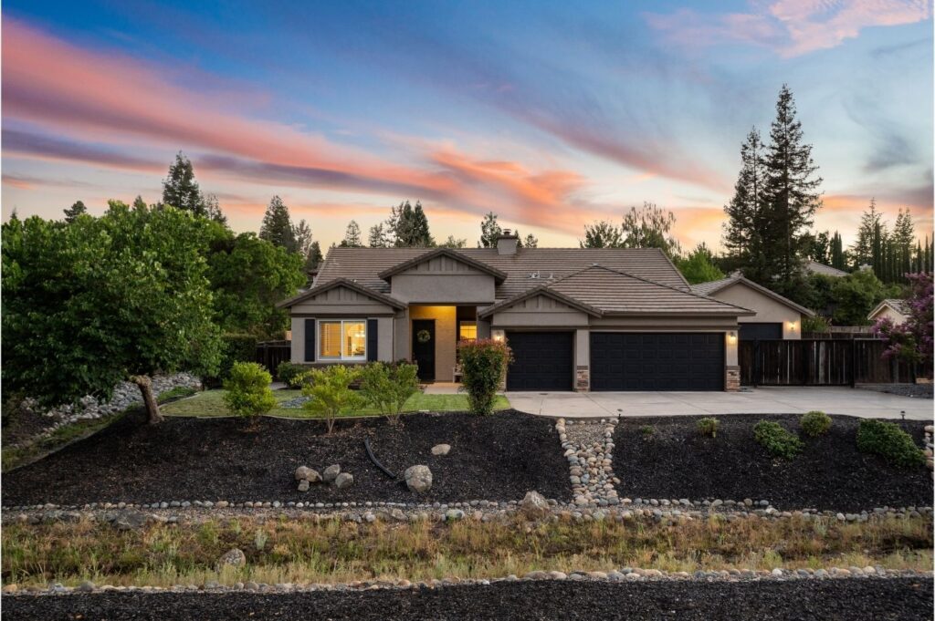 street view of luxury home at twilight