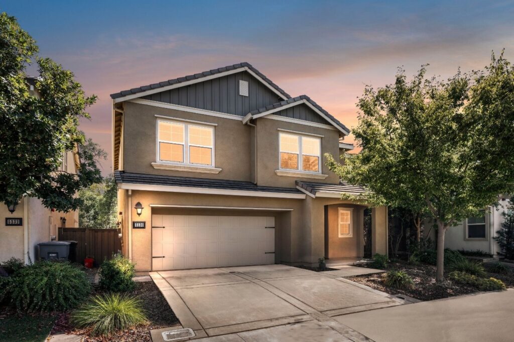 street view of two story home at twilight